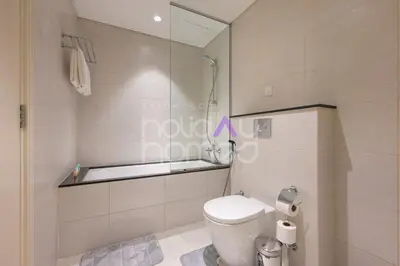 a bathroom with a toilet and a shower in it at Elegant Studio apartment in Avanti Tower Business Bay in Dubai