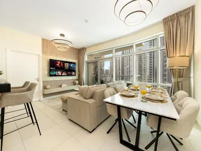 a living room with a couch and a table at Luxury Stay in Downtown-Steps to Burj & Dubai Mall in Dubai
