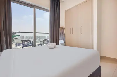 a bedroom with a large bed and a large window at STAY BY LATINEM Luxury 1BR Holiday Home CVR A511 near Downtown in Dubai