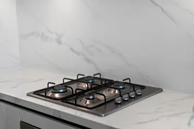 a stove top oven sitting on top of a counter at One Park Avenue, Sobha Hartland 3 BR in Dubai