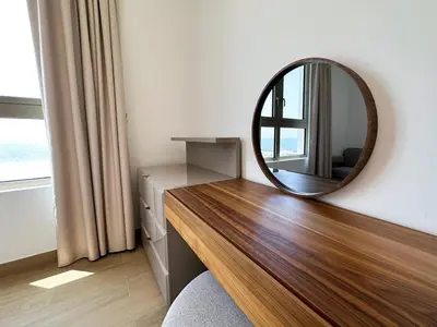 a mirror on top of a dresser in a room at NYE Firework View - Beachfront Residence - Sea View in Dubai