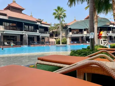 a view of a swimming pool at a resort at Specious 1 Br In Royal Amwaj Residences South in Dubai