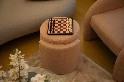 a chess board sitting on top of a chair at Stylish Beachfront Creek Escape in Dubai