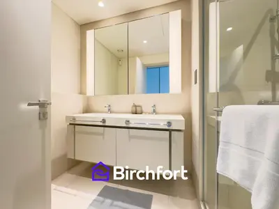 a bathroom with a sink and a mirror at Spacious 3,5 BHK with Amazing View in Dubai