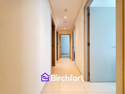 a corridor in a building with an open door at Spacious 3,5 BHK with Amazing View in Dubai