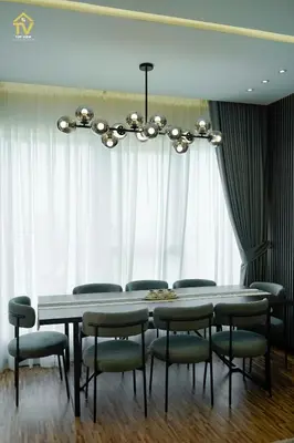 a dining room with a table and chairs and a chandelier at TOP VIEW Luxury 2 bedrooms in Dubai only families in Dubai
