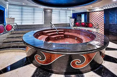 a large fountain in the middle of a room at Mayfair Luxury Apartment in 5-Star DAMAC Maison Mall Street Building, Downtown Dubai in Dubai
