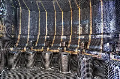 a bunch of metal drums in a cage at Mayfair Luxury Apartment in 5-Star DAMAC Maison Mall Street Building, Downtown Dubai in Dubai