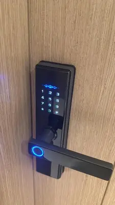 a remote control sticking out of a door at Apartment In Creek Beach in Dubai