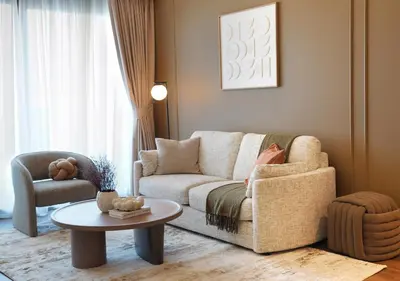 a living room with a couch and a table at Chic 2BR in Downtown, 5 Min Walk to Burj Khalifa in Dubai