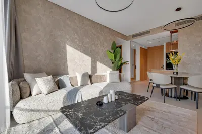 a living room with a couch and a table at Burj View Direct to Dubai Mall 2BR in Dubai