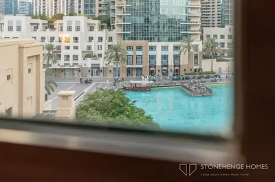 a view of a large swimming pool in a city at Chic 1BR Apartment in Downtown Dubai Steps Away from Burj Khalifa & Dubai Mall in Dubai