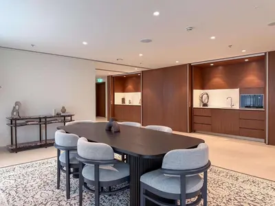 a large dining room with a table and chairs at Luxury 1 Bedroom in Emaar Beach Front - Dubai Marina - Private Beach in Dubai