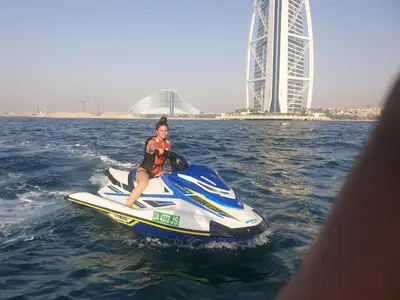 a man riding a jet ski in the water at A one sports jetski rental in Dubai