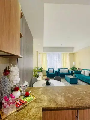 a large living room with a couch and a table at Luxurious 1 Bedroom Apartment in Heart of Dubai in Dubai