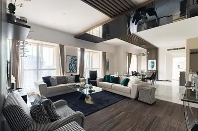a living room with two couches and a table at Lux Penthouse 4BR Apartment with Iconic Marina Views in Sadaf2 JBR by Simply Comfort in Dubai