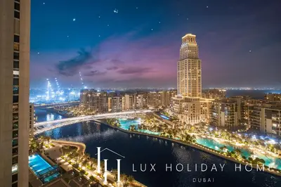 a view of a city at night at LUX The Creek Palace Residence Suite 2 in Dubai