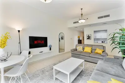 a living room with a couch and a table at Bright 1BR with Canal Views Near Burj Khalifa in Dubai