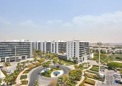 an aerial view of a city with tall buildings at Radiant & Sunny Living - 1BR in ORchid DAMAC Hills in Dubai