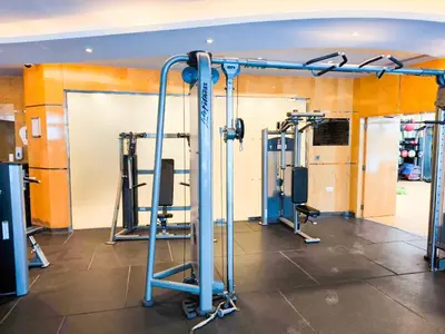 a gym with several tread machines in a room at Luxuries Sky View Apartment in Dubai
