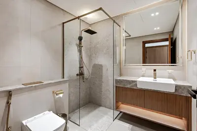 a bathroom with a shower and a toilet and a sink at Inviting 1BR Apartment in JVC in Dubai