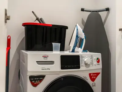a washing machine with a basket on top of it at Modern Jumeirah Apartment Near Beach in Dubai