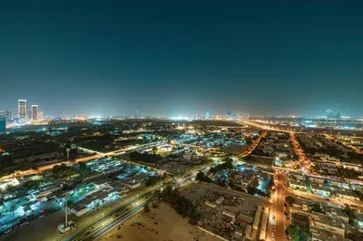 an aerial view of a city at night at Exquisite 2BR Apartment near Dubai Mall, Downtown Dubai in Dubai