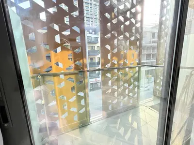 a glass door with a view of a building at A place like home in Dubai