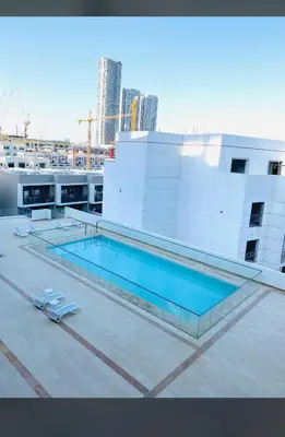 a swimming pool on the roof of a building at A place like home in Dubai