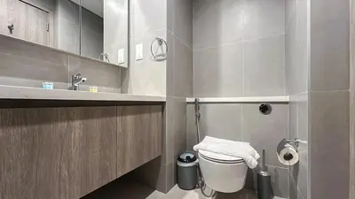 a bathroom with a toilet and a sink at Exclusive 1BR, Panoramic Marina View, Dubai Marina - 21AB02 in Dubai