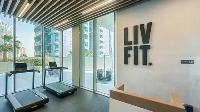 a gym with two elliptical machines in a building at Exclusive 1BR, Panoramic Marina View, Dubai Marina - 21AB02 in Dubai