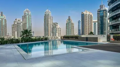a swimming pool in a city with tall buildings at Exclusive 1BR, Panoramic Marina View, Dubai Marina - 21AB02 in Dubai