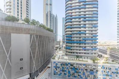a view of two tall buildings in a city at Walking distance to Dubai Mall and Burj Khalifa, Easy access to Dubai Metro and Top attractions, Dunya Tower, Downtown Dubai by Deluxe Holiday Homes in Dubai