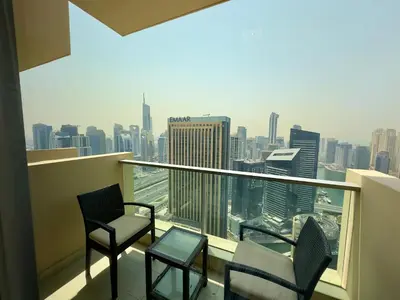 a balcony with chairs and a view of the city at JW Marriott Marina Residences in Dubai