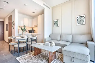 a living room with a couch and a table at STAY BY LATINEM Luxury 1BR Holiday Home CB 1210 Near Burj Khalifa in Dubai
