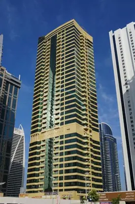 a tall building in the middle of a city at Chic Waterfront Location with Direct Metro Access and a Glimpse of Ain Dubai, Lake City Tower, Jumeirah Lake Towers by Deluxe Holiday Homes in Dubai