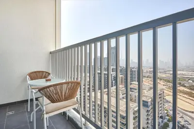 a balcony with a table and chairs and a city view at STAY BY LATINEM Luxury 1BR Holiday Home CB 1807 Near Downtown in Dubai