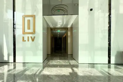 a hallway of a building with a sign on the wall at Luxury 1-Bedroom Apartment with Full Marina View in Dubai