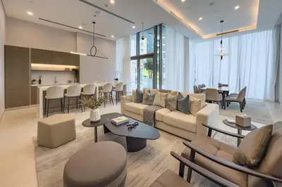 a living room with a couch and a table at Panoramic High-Floor 1BR Overlooking Yachts and Dubai Water Canal, Moments from JBR Beach, LIV MarinaMarine Transport, and Skydive Dubai, LIV Marina, Dubai Marina by Deluxe Holiday Homes in Dubai