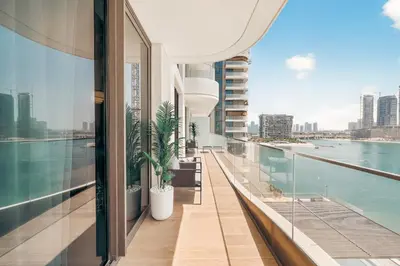 a balcony of a building with a view of the water at Luxury 2BR Retreat Gorgeous Beach & Skyline Views in Dubai