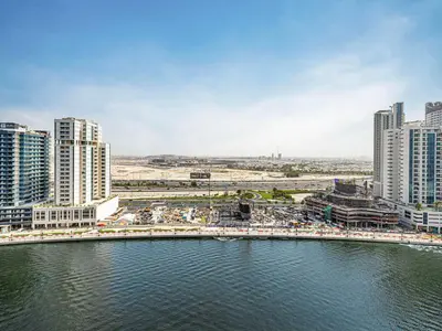 a city with a bridge over a body of water at Livin' Holidays - Studio - Bay View with Jacuzzi in Dubai