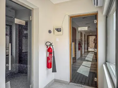 a fire hydrant is on the side of a building at Radiant - 3BR - JVC - near Sports City & Autodrome in Dubai