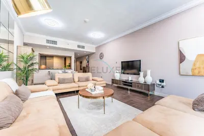 a living room with couches and a tv at Apartment near Burj Khalifa and Dubai Mall, Central Location, Minutes to Dubai Marina and Palm Jumeirah - 8 BLVD Walk, Downtown Dubai by Deluxe Holiday Homes in Dubai