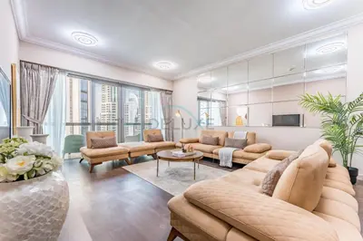 a living room with a couch and a table at Apartment near Burj Khalifa and Dubai Mall, Central Location, Minutes to Dubai Marina and Palm Jumeirah - 8 BLVD Walk, Downtown Dubai by Deluxe Holiday Homes in Dubai