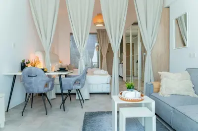 a living room with a couch and a table at Scent of the Palms by Lagom in Dubai