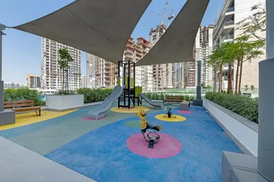 a playground with a slide at Chic Dubai Retreat at Azizi Riviera 65 in Dubai