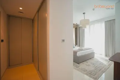 a bathroom with a white sink and a mirror at Exclusive Home with Private Beach in Dubai