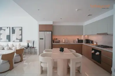 a kitchen with a table and chairs in a kitchen at Exclusive Home with Private Beach in Dubai