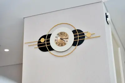 a clock shaped like a cat on a wall at Executive 2-Bedroom Apartment in Downtown views 2 with access to Dubai mall in Dubai