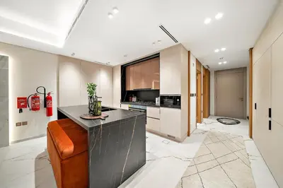 a kitchen with a counter and a stove top oven at FIRST CLASS VILLA Hidden Luxury Gem in Dubai